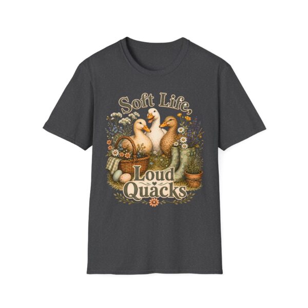T-Shirt — "Soft Life, Loud Quacks" Cute Duck Graphic Tee one dramatic duck standing in shallow pond water with cattails, ripples, reeds, and a slightly judgmental expression. Give the duck a...