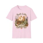 T-Shirt — "Soft Life, Loud Quacks" Cute Duck Graphic Tee one dramatic duck standing in shallow pond water with cattails, ripples, reeds, and a slightly judgmental expression. Give the duck a...