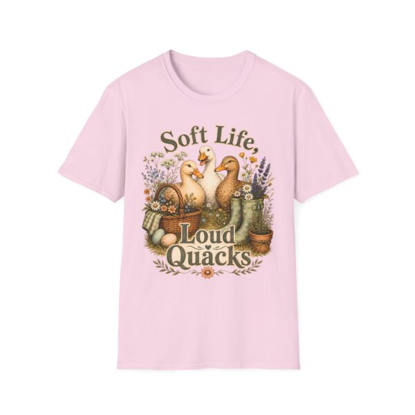 T-Shirt — "Soft Life, Loud Quacks" Cute Duck Graphic Tee one dramatic duck standing in shallow pond water with cattails, ripples, reeds, and a slightly judgmental expression. Give the duck a...