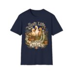T-Shirt — "Soft Life, Loud Quacks" Cute Duck Graphic Tee one dramatic duck standing in shallow pond water with cattails, ripples, reeds, and a slightly judgmental expression. Give the duck a...