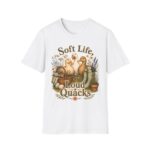 T-Shirt — "Soft Life, Loud Quacks" Cute Duck Graphic Tee one dramatic duck standing in shallow pond water with cattails, ripples, reeds, and a slightly judgmental expression. Give the duck a...
