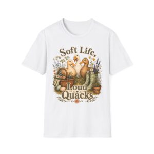 T-Shirt — "Soft Life, Loud Quacks" Cute Duck Graphic Tee one dramatic duck standing in shallow pond water with cattails, ripples, reeds, and a slightly judgmental expression. Give the duck a...