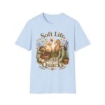 T-Shirt — "Soft Life, Loud Quacks" Cute Duck Graphic Tee one dramatic duck standing in shallow pond water with cattails, ripples, reeds, and a slightly judgmental expression. Give the duck a...