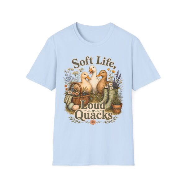 T-Shirt — "Soft Life, Loud Quacks" Cute Duck Graphic Tee one dramatic duck standing in shallow pond water with cattails, ripples, reeds, and a slightly judgmental expression. Give the duck a...