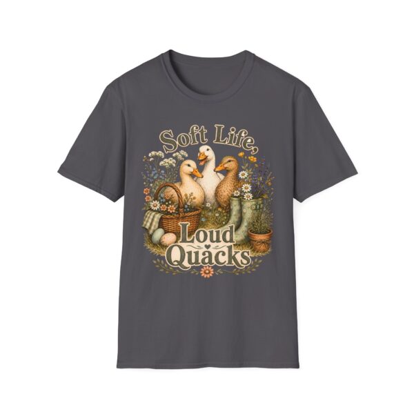 T-Shirt — "Soft Life, Loud Quacks" Cute Duck Graphic Tee one dramatic duck standing in shallow pond water with cattails, ripples, reeds, and a slightly judgmental expression. Give the duck a...