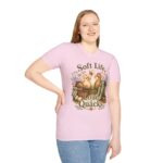 T-Shirt — "Soft Life, Loud Quacks" Cute Duck Graphic Tee one dramatic duck standing in shallow pond water with cattails, ripples, reeds, and a slightly judgmental expression. Give the duck a...