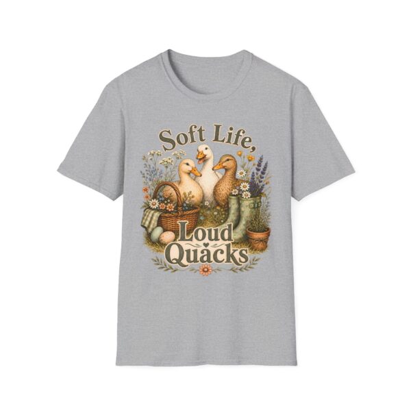 T-Shirt — "Soft Life, Loud Quacks" Cute Duck Graphic Tee one dramatic duck standing in shallow pond water with cattails, ripples, reeds, and a slightly judgmental expression. Give the duck a...