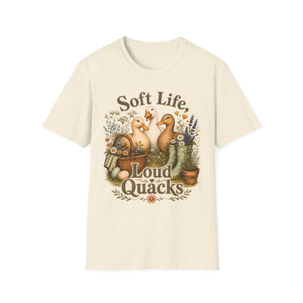 T-Shirt — "Soft Life, Loud Quacks" Cute Duck Graphic Tee one dramatic duck standing in shallow pond water with cattails, ripples, reeds, and a slightly judgmental expression. Give the duck a...