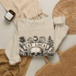 Eat Local Stay Cautious skull illustration Sweatshirt | botanical apothecary design