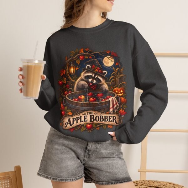 Crewneck Sweatshirt — "The Apple Bobber" Halloween Raccoon Apple-Bobbing Design