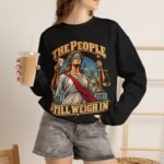 Crewneck Sweatshirt — "The People Still Weigh In" Lady Justice Graphic
